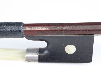 Lot 690 - A German violin bow having a white metal...