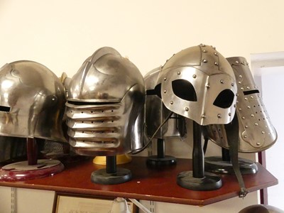 Lot 16 - A collection of reproduction metal helmets