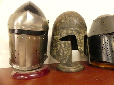 Lot 16 - A collection of reproduction metal helmets