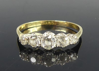 Lot 2827 - A yellow and white metal diamond half eternity...