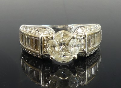Lot 2832 - A white metal diamond dress ring, featuring a...