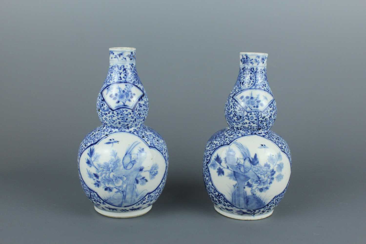 Lot 1 - A pair of Chinese blue and white double gourd...