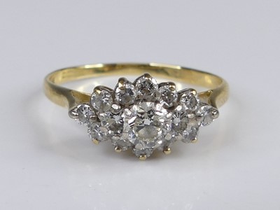 Lot 2835 - An 18ct gold diamond lozenge cluster ring,...