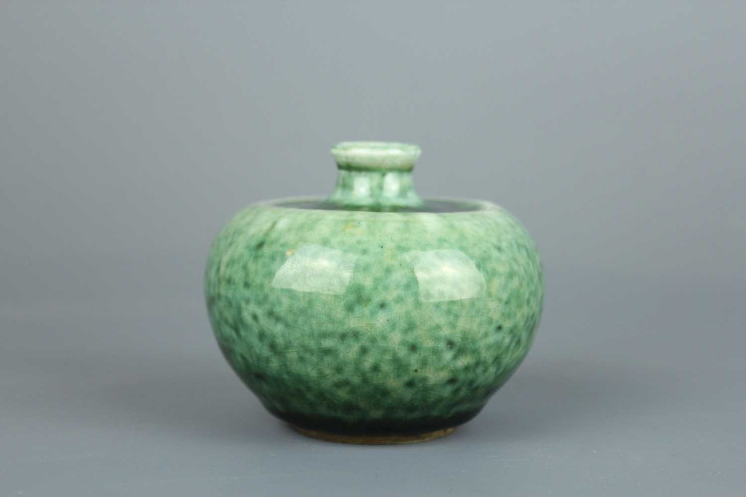 Lot 56 - A Chinese peachbloom-glazed apple-shaped water...
