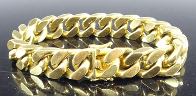 Lot 2841 - A modern 18ct gold flat curblink heavy...