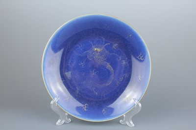Lot 65 - A pair of Chinese blue ground gilded “dragon”...