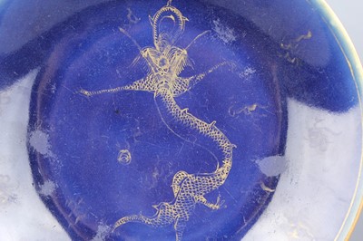 Lot 65 - A pair of Chinese blue ground gilded “dragon”...