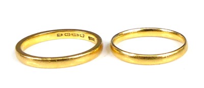Lot 2849 - A 22ct gold court shaped wedding band, size K,...