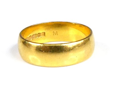 Lot 2850 - A modern 22ct gold court shaped wedding band,...