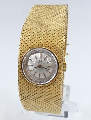 Lot 2858 - An Omega lady's 18ct gold cased bracelet watch,...