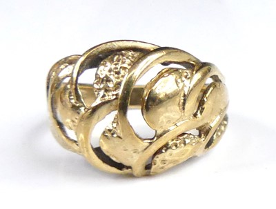 Lot 2865 - A 9ct gold band ring, the raised and carved...