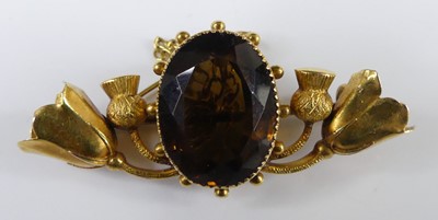 Lot 2928 - A Scottish yellow metal and citrine set brooch,...