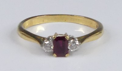 Lot 2929 - An 18ct gold ruby & diamond three stone dress...