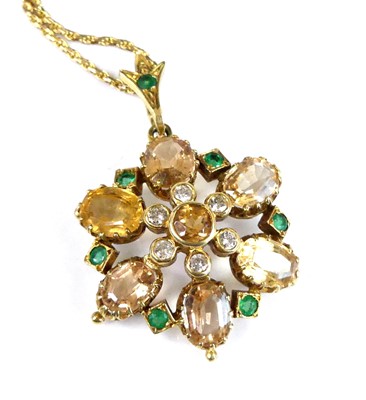 Lot 2934 - A yellow metal citrine, emerald and diamond...