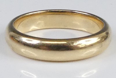 Lot 2939 - A modern 9ct gold court shaped wedding band,...