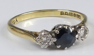 Lot 2940 - An 18ct gold sapphire and diamond three stone...
