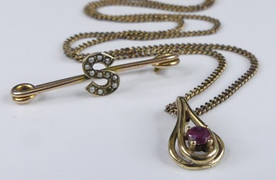 Lot 2942 - A modern 9ct gold and ruby set pear shaped...
