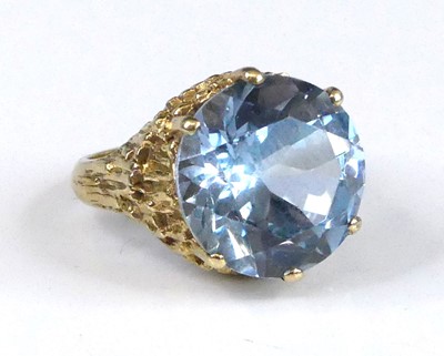 Lot 2964 - A modern yellow metal and blue zircon set...