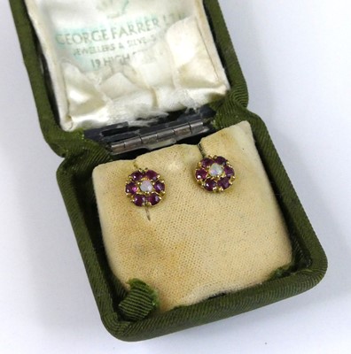Lot 2963 - A pair of 9ct gold, opal and ruby set ear...