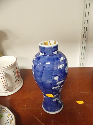 Lot 69 - A Chinese blue and white porcelain prunus vase,...