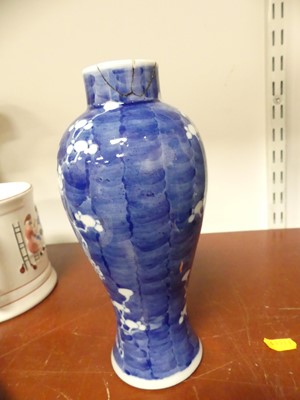 Lot 69 - A Chinese blue and white porcelain prunus vase,...