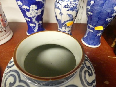 Lot 69 - A Chinese blue and white porcelain prunus vase,...