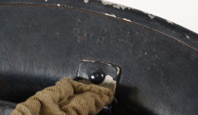Lot 614 - A WW II Brodie pattern Home Guard helmet,...