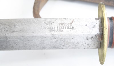 Lot 647 - A WW II fighting knife, having a 16.5cm double...