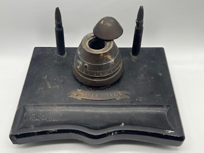 Lot 652 - A WWI trench art inkwell, a brass fuse hinged...