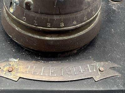 Lot 652 - A WWI trench art inkwell, a brass fuse hinged...