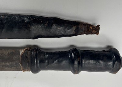 Lot 659 - A 19th Century African short sword / hunting...