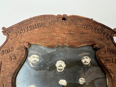 Lot 662 - A wooden photo frame with carved decoration...