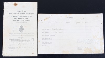 Lot 650 - A WW II Babies Protective Helmet, in original...