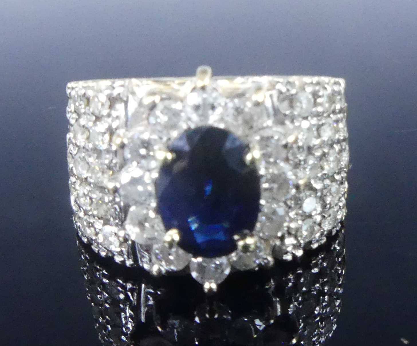 Lot 2621 - A yellow and white metal, sapphire and diamond...