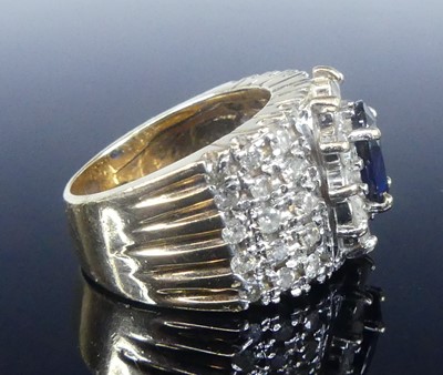 Lot 2621 - A yellow and white metal, sapphire and diamond...