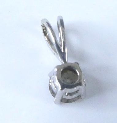Lot 2622 - An 18ct white gold single stone pendant,...