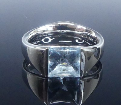 Lot 2624 - A white metal blue topaz single stone ring,...
