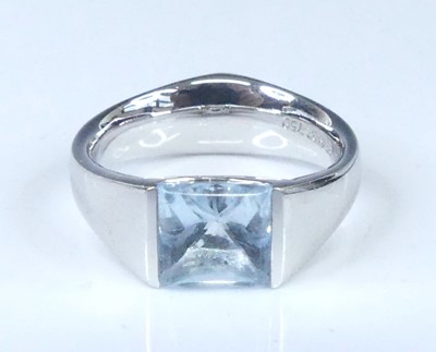 Lot 2624 - A white metal blue topaz single stone ring,...