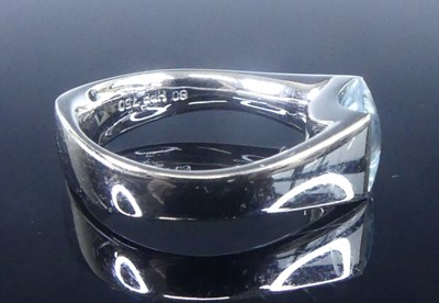 Lot 2624 - A white metal blue topaz single stone ring,...