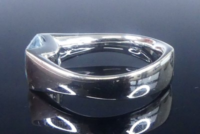 Lot 2624 - A white metal blue topaz single stone ring,...