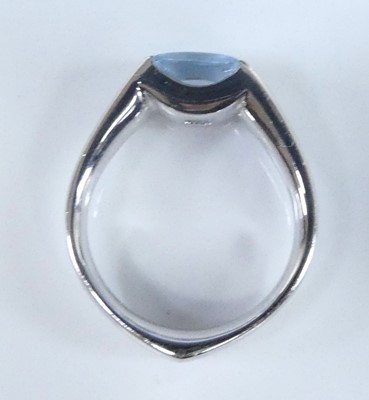 Lot 2624 - A white metal blue topaz single stone ring,...