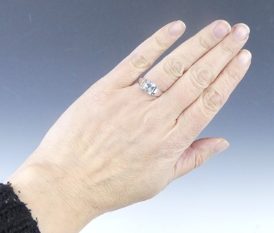 Lot 2624 - A white metal blue topaz single stone ring,...