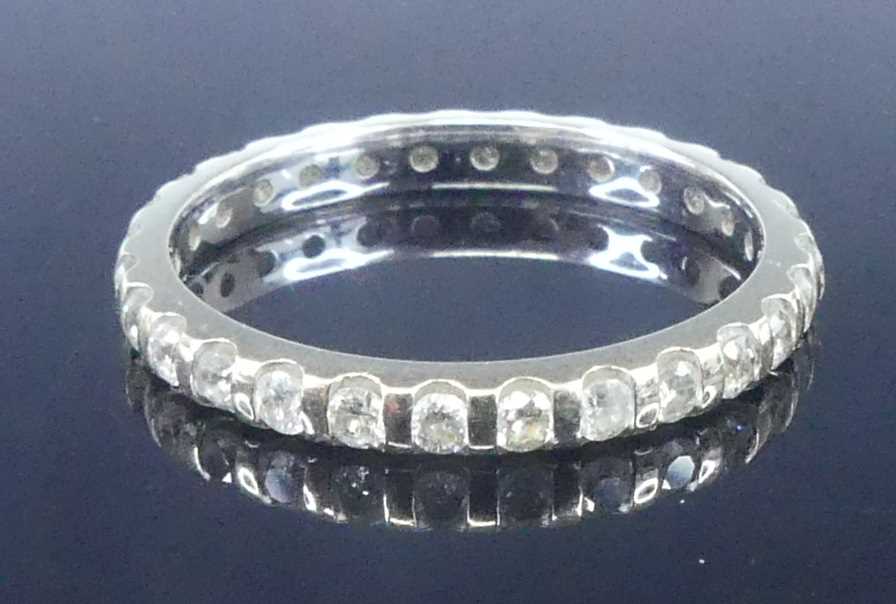 Lot 2625 - A white metal diamond eternity ring,...