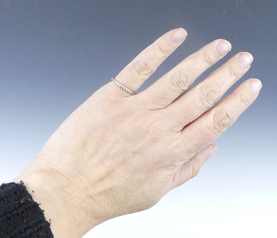 Lot 2625 - A white metal diamond eternity ring,...