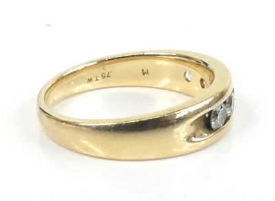 Lot 2630 - A yellow metal diamond half eternity ring,...