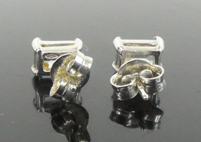Lot 2647 - A pair of 18ct white gold aquamarine single...