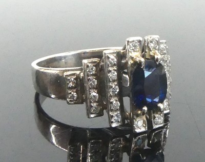 Lot 2648 - A white metal, sapphire and diamond lozenge...