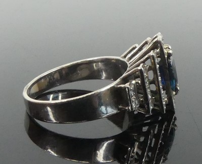 Lot 2648 - A white metal, sapphire and diamond lozenge...