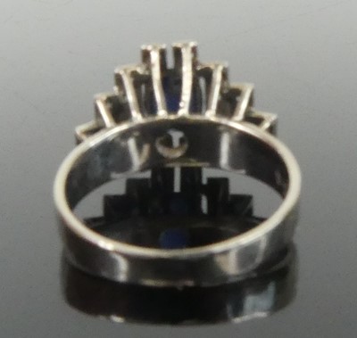 Lot 2648 - A white metal, sapphire and diamond lozenge...
