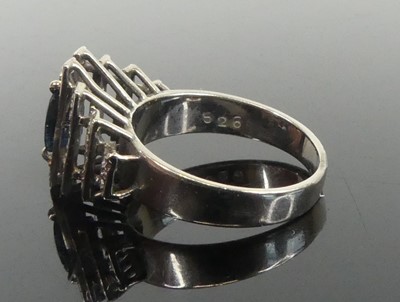 Lot 2648 - A white metal, sapphire and diamond lozenge...